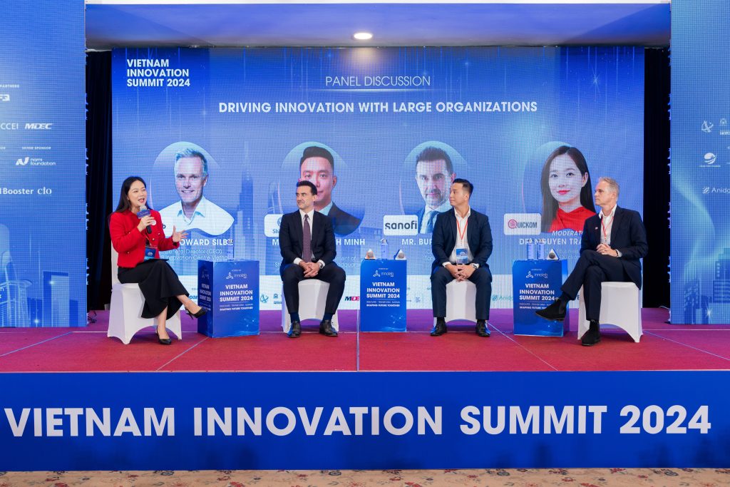 Panelists sharing insights on digital transformation in large organizations